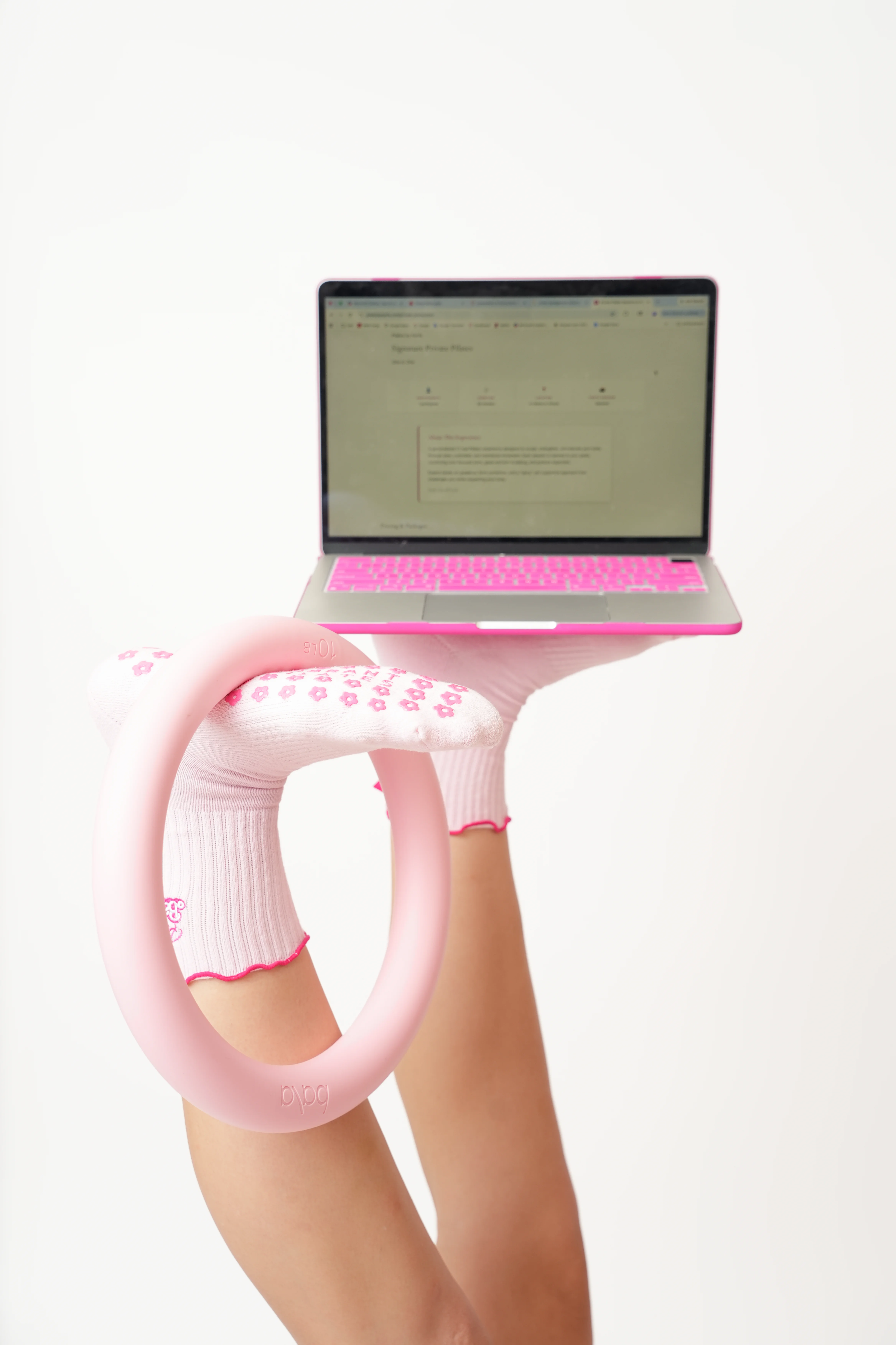 Pilates ring and laptop — book your private Pilates session